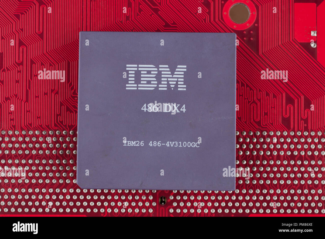 KYIV, UKRAINE - July 28, 2018. IBM 486DX4 processor on red circuit board. Stock Photo