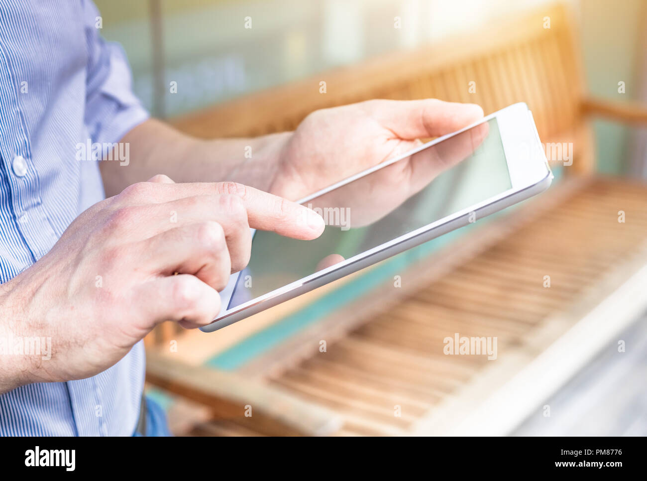 Digital tablet computer, businessman using wireless internet device to type email at office outdoor, closeup of hands touching screen Stock Photo