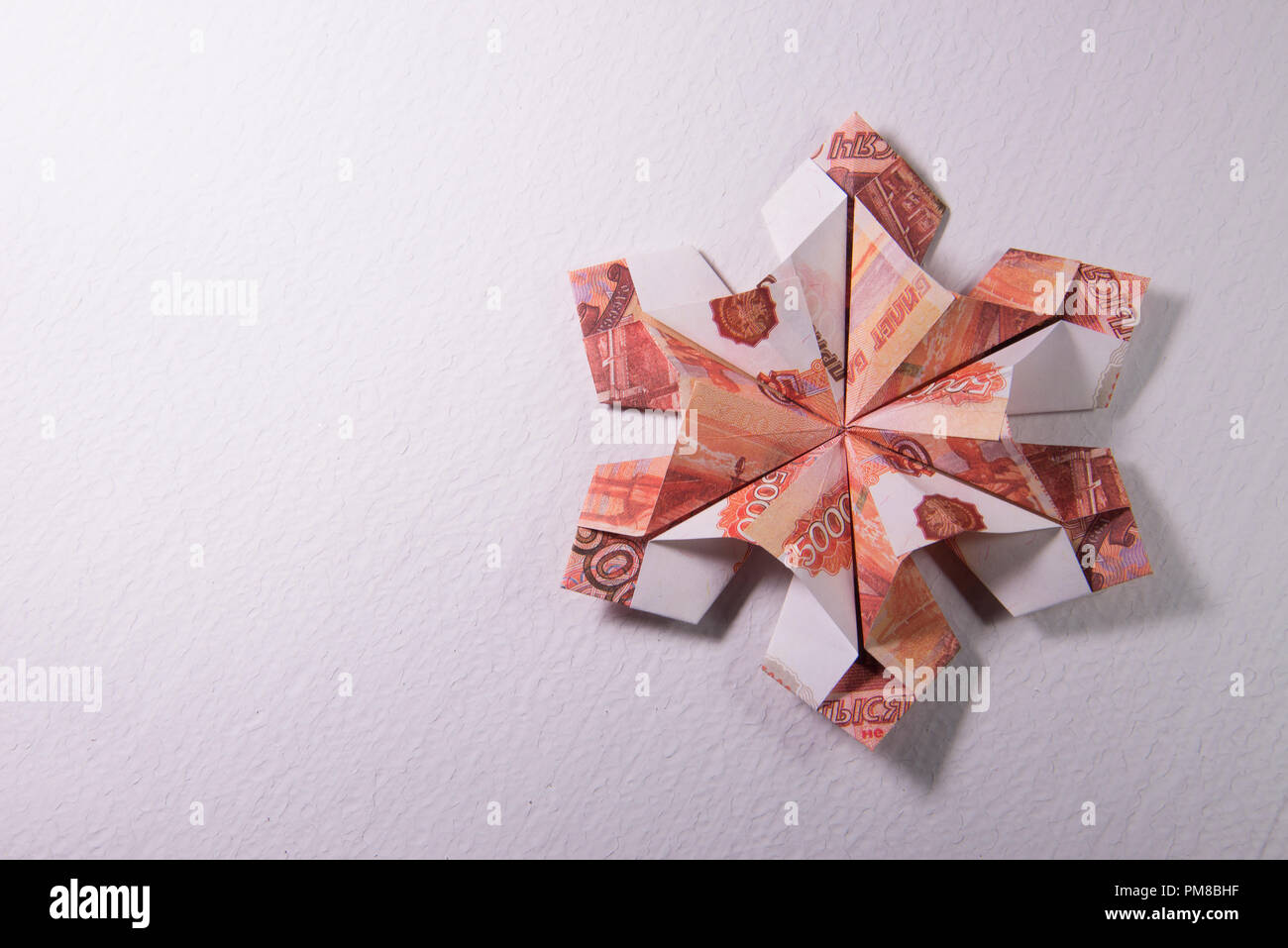 Money Origami snowflake Stock Photo - Alamy
