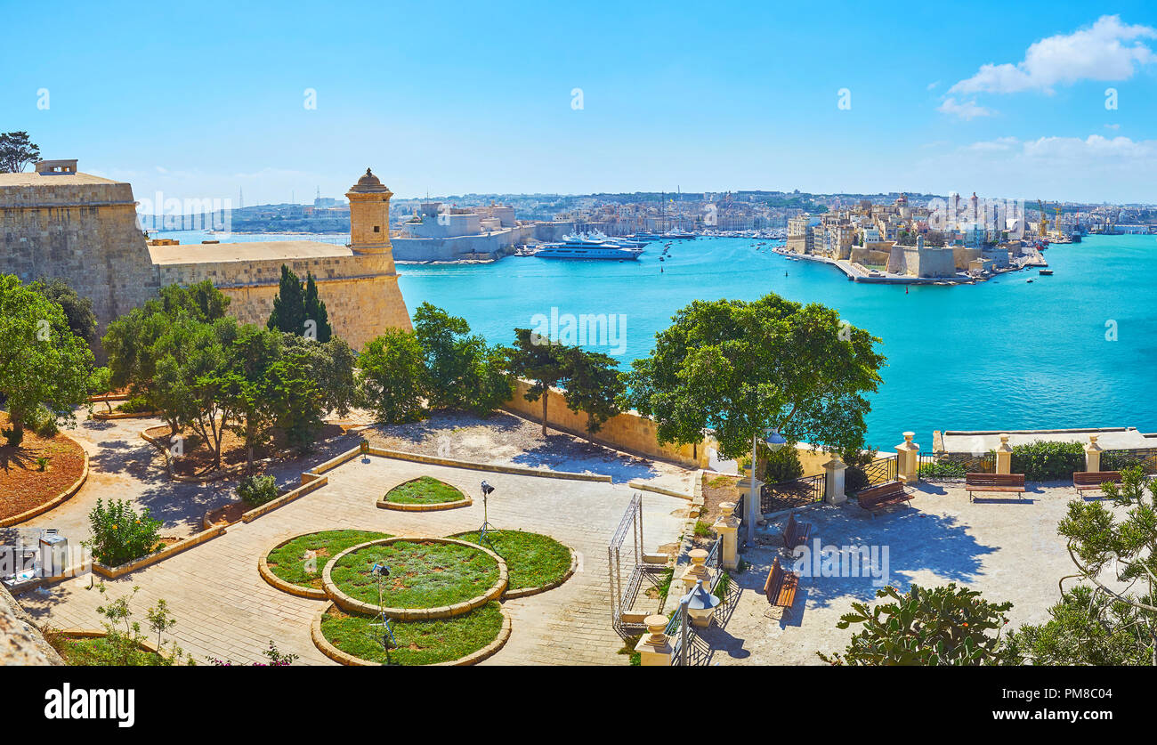 The scenic ornamental terrace of Herbert Ganado Gardens next to St Peter and Paul Counterguard with a view on Valletta Grand Harbour on the background Stock Photo