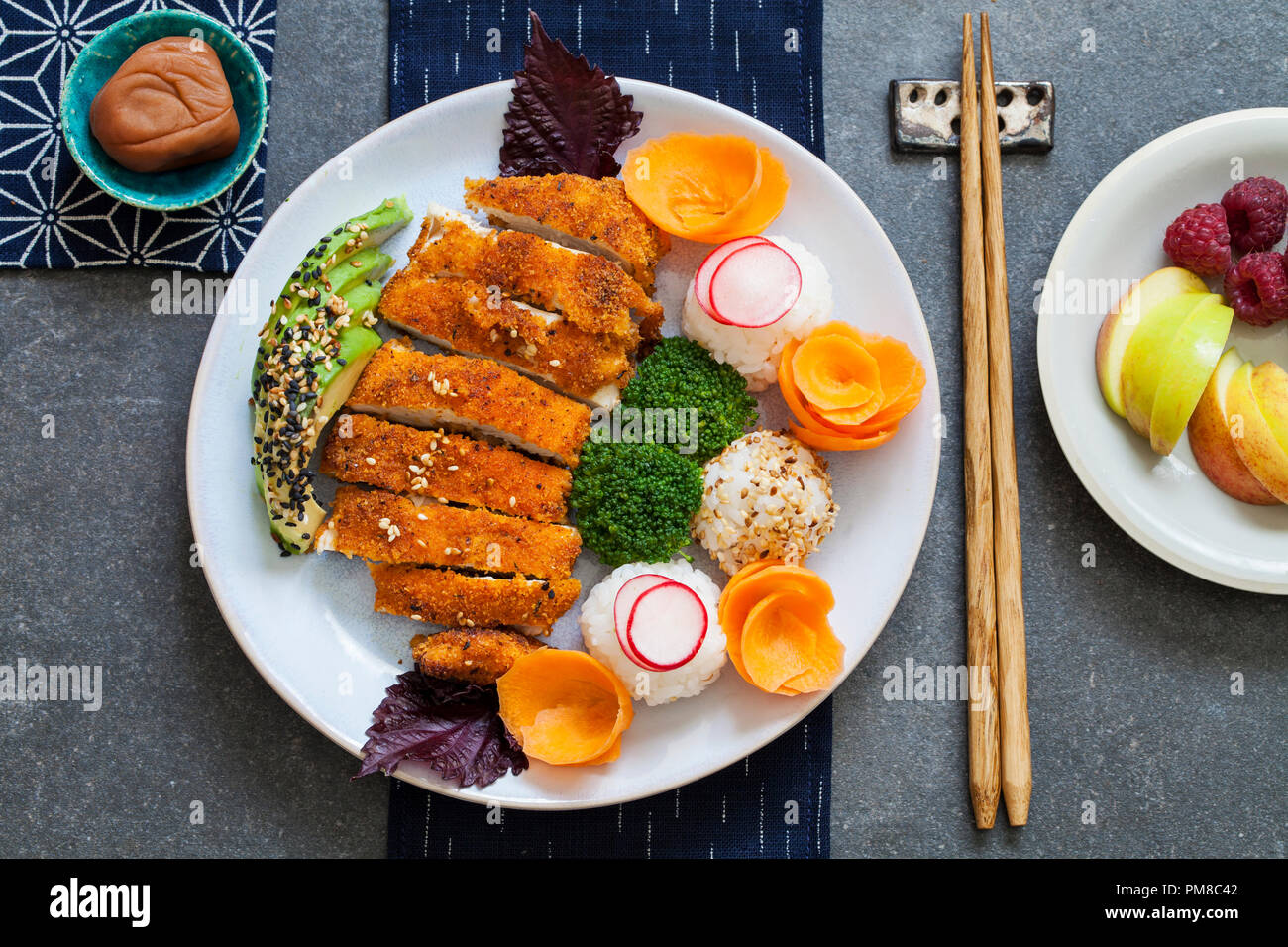 Japanese style lunch with onigiri rice balls and crispy chicken Stock