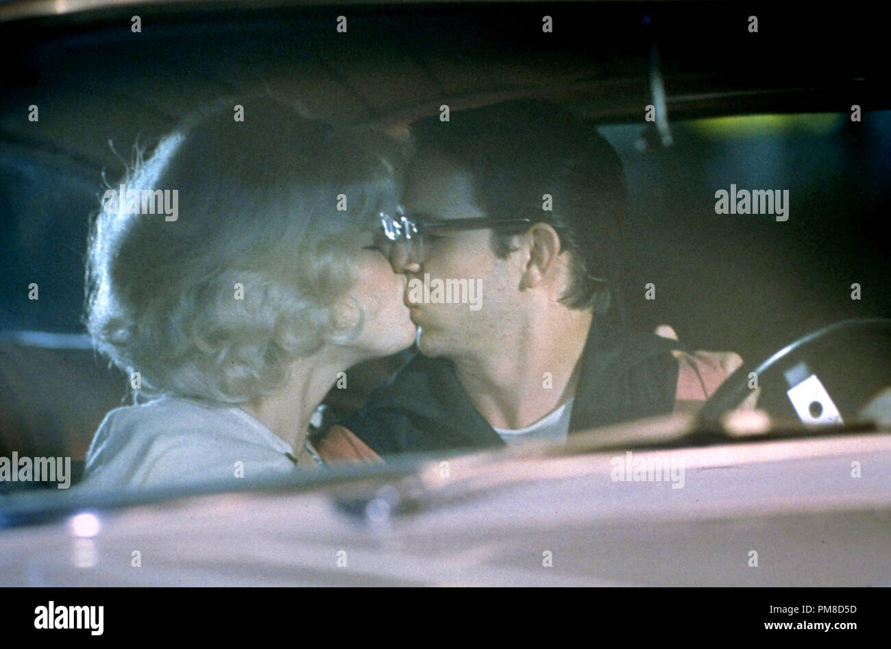 Studio Publicity Still: 'American Graffiti' 1973 Universal  Candy Clark, Charles Martin Smith   File Reference # 31955 304THA Stock Photo