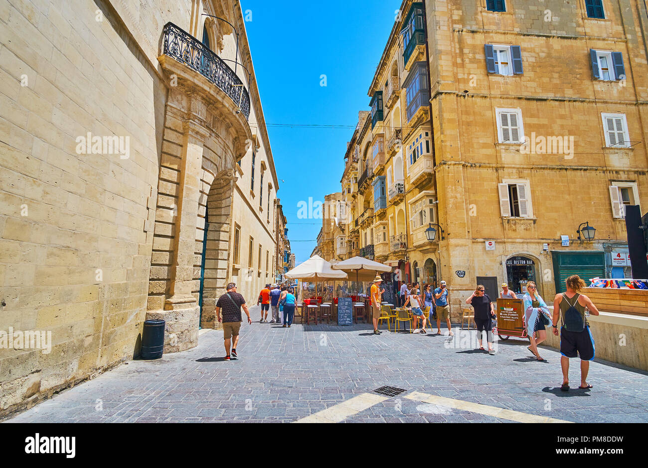 VALLETTA, MALTA - JUNE 17, 2018: Merchants street is pedestrian shopping area with numerous stores, establishments and small outdoor cafes, on June 17 Stock Photo