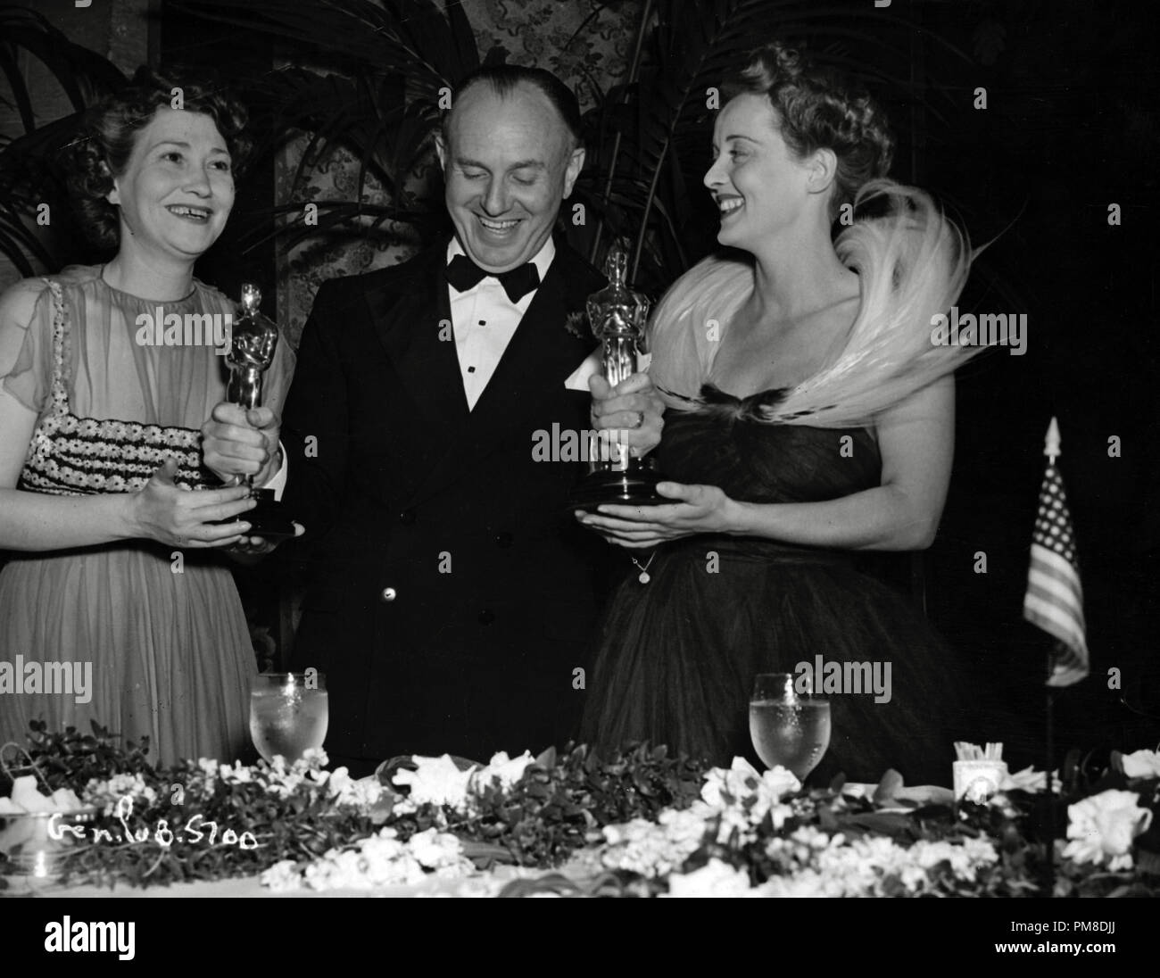 Faye Bainter, Jack L. Warner and Bette Davis at the 11th Annual Academy Awards, 1939   File Reference # 31955 611THA Stock Photo