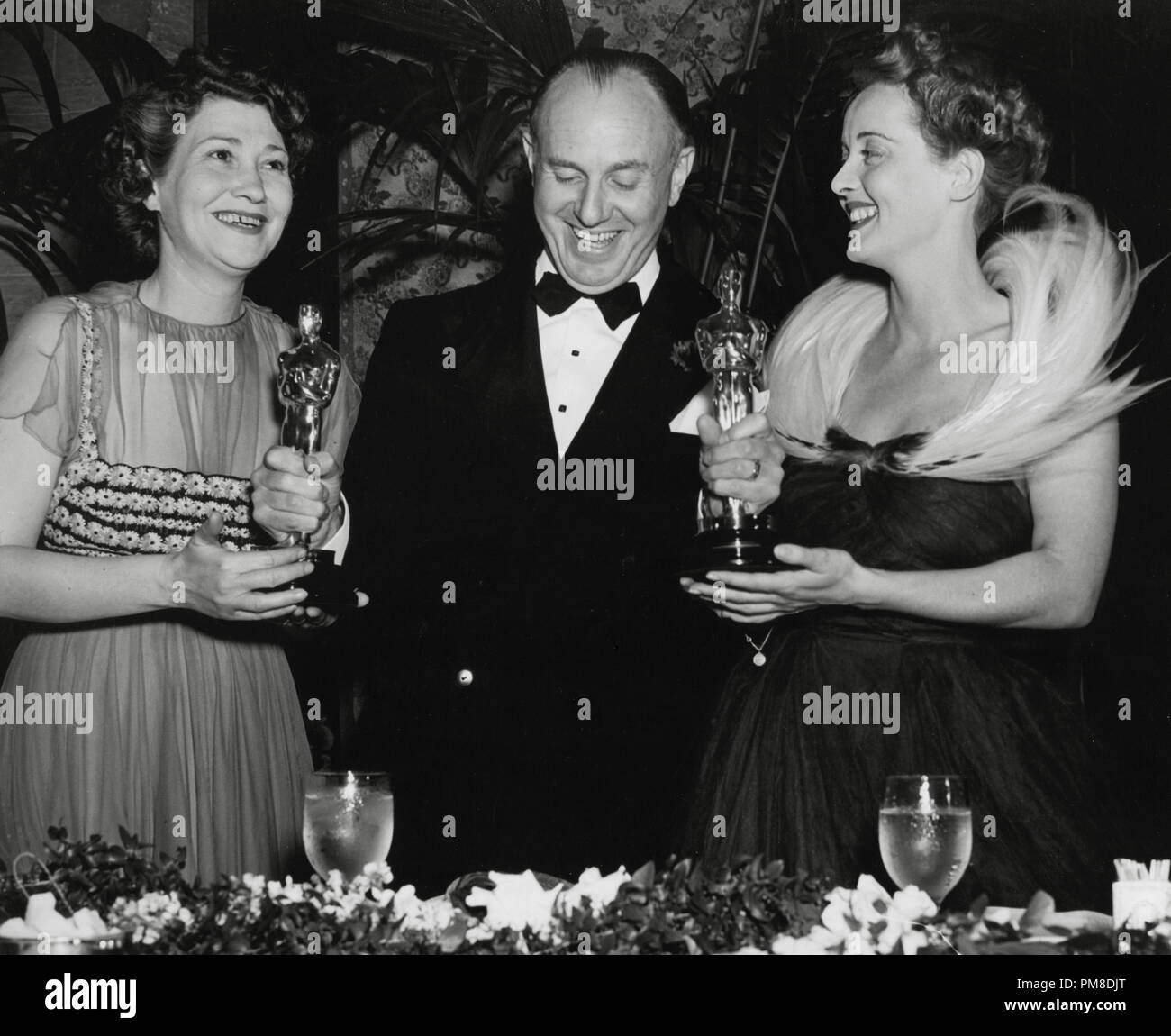 Faye Bainter, Jack Warner and Bette Davis at the 11th Annual Academy Awards, 1939   File Reference # 31955 613THA Stock Photo