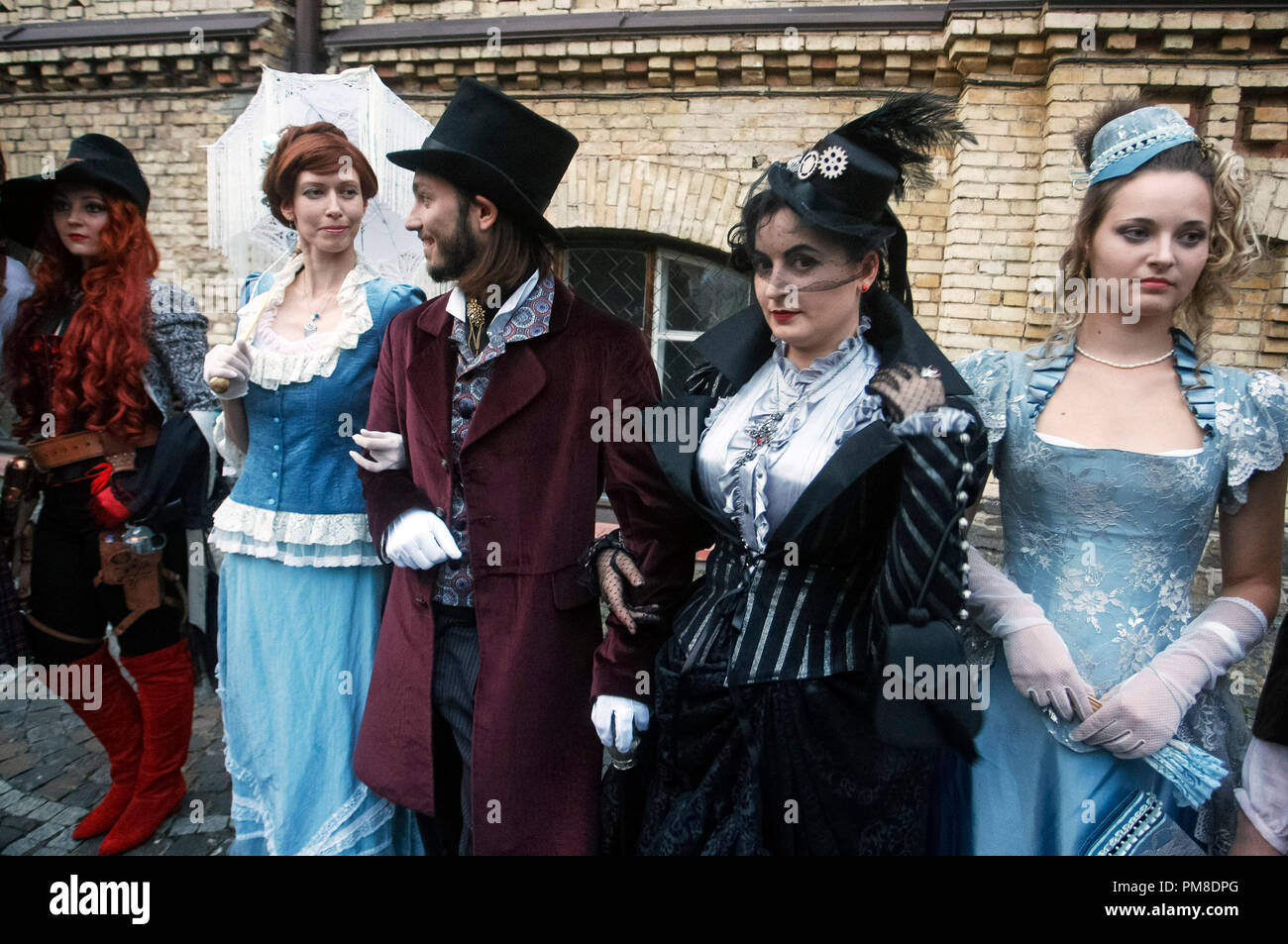 Visitors wearing steampunk costumes are seen during 'VI KyivSteamCon' event in Kiev.The Steampunk festival involving workshops, talks, competitions, dances and lectures attracts fans of subgenre steampunk, cosplay and science fiction. Stock Photo