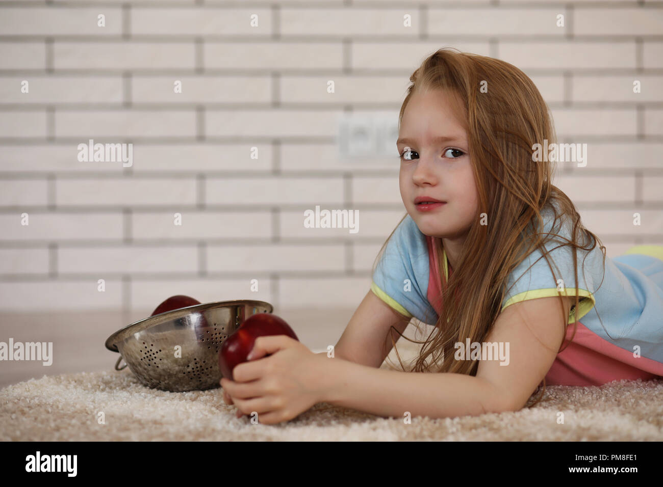 little girl lies on the floor Stock Photo - Alamy