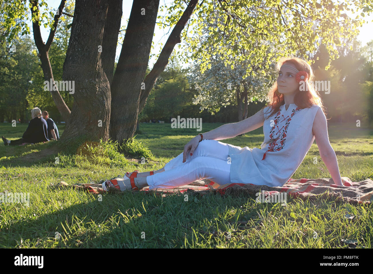 A girl on a walk in an autumn park. Young red-haired girl in the Stock ...
