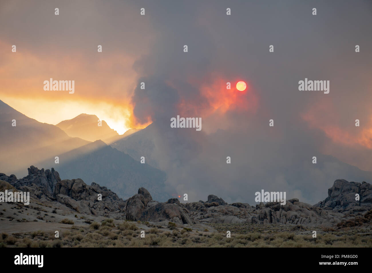 Sun shines through the smoke of the Georges Fire, a California Wildfire in the Eastern Sierra Nevada Mountains in 2018 Stock Photo