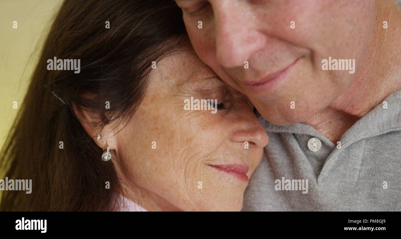 Loving older couple hugging each other Stock Photo