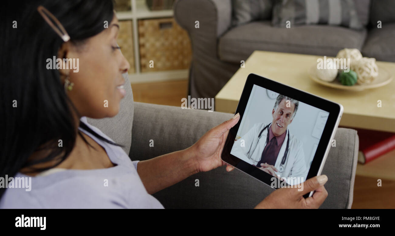 Black woman consulting doctor hi-res stock photography and images - Alamy