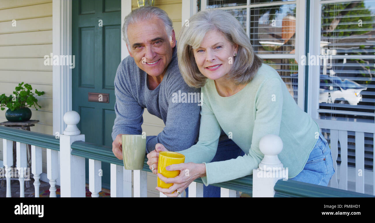 Portrait happy couple on porch hi-res stock photography and images - Alamy