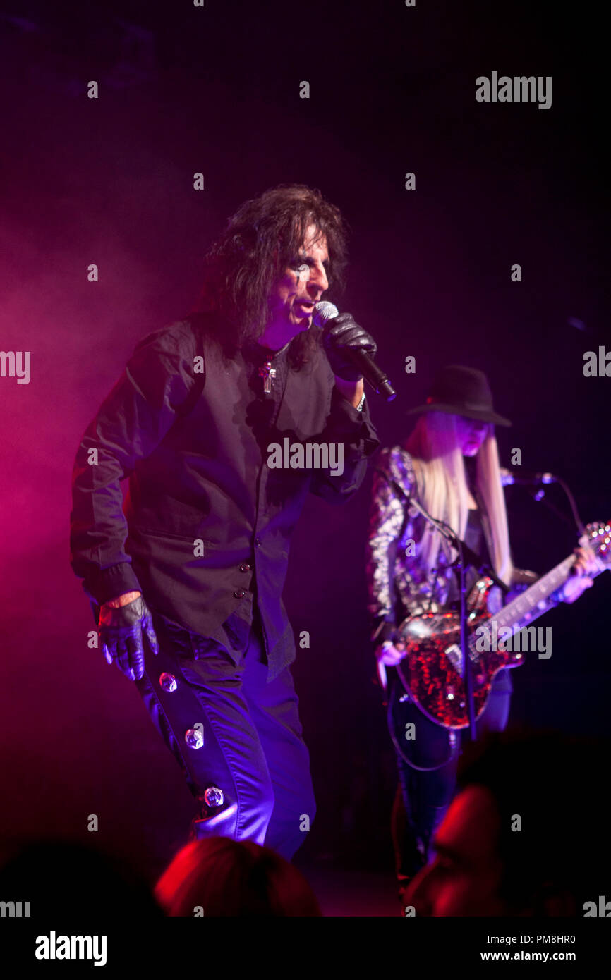 (L-r) ALICE COOPER and band mate ORIANTHI appear in concert at the premiere party for Warner Bros. Pictures’ and Village Roadshow Pictures’ “DARK SHADOWS,” a Warner Bros. Pictures release, in Hollywood. Stock Photo