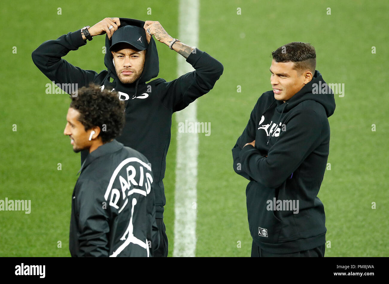 Paris Saint-Germain's Neymar (left) with Marquinhos and Thiago Silva (right) during a walk around the Anfield pitch, Liverpool. Stock Photo
