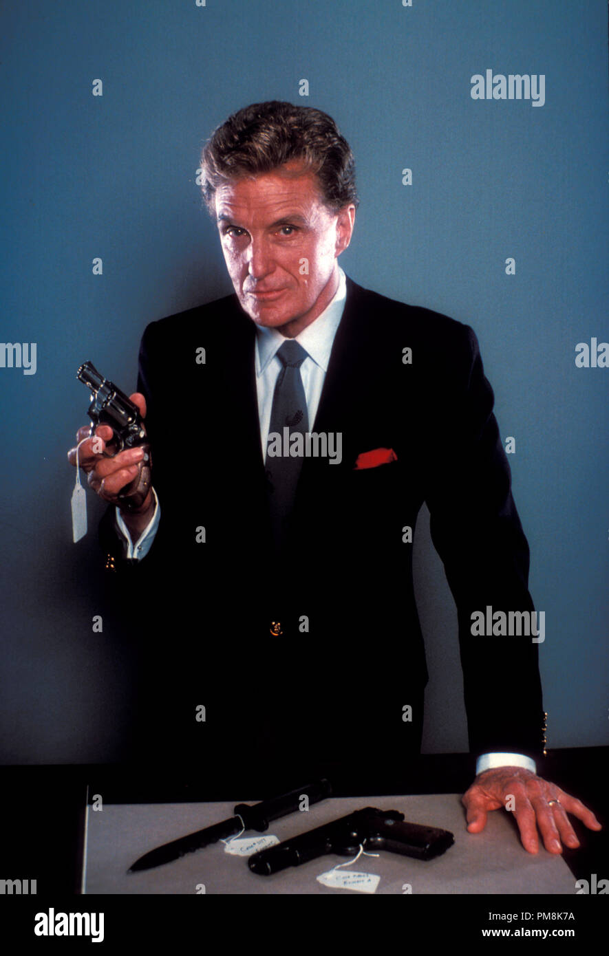 Film still or Publicity still from 'Unsolved Mysteries' Robert Stack, 1989  All Rights Reserved   File Reference # 31623022THA  For Editorial Use Only Stock Photo