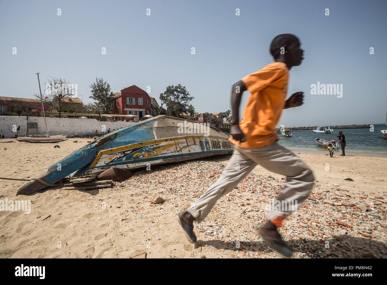 Young boy in the beach of Goree island Stock Photo