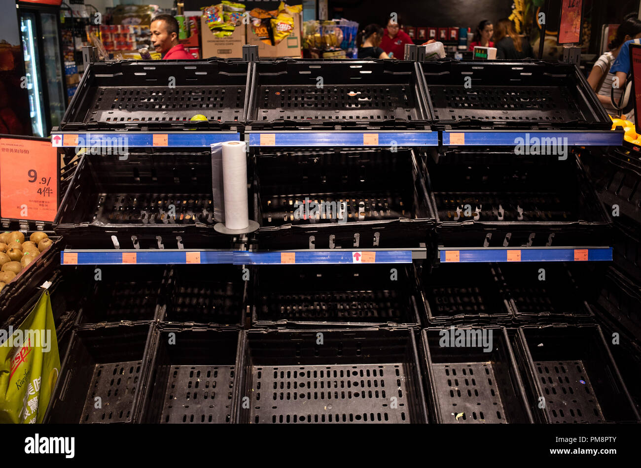 Empty Supermarket shelves as residents stock up ahead of Super Typhoon Mangkhut arrival in Hong Kong, China. It is expected to land with a typhoon signal No. 8. Stock Photo