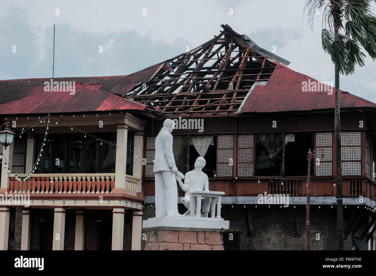 The roof of Kapitan Moy,a 200-year-old house of Don Laureano Guevarra, got flown away the by strong wind brought by the tornado. The accident also happened while there was a wedding reception inside the house. On September 14 2018, Super Typhoon Mangkhut hit the Philippines with wind speed of 205 kilometers per hour (kph), and gusts reaching 255 kph.  More than a thousand of Filipino citizens all over the country have been affected. Forecasters have called the Manghut as one ofthe strongest typhoon this year. Mangkhut is the 15th storm to batter the Philippines this year. Stock Photo