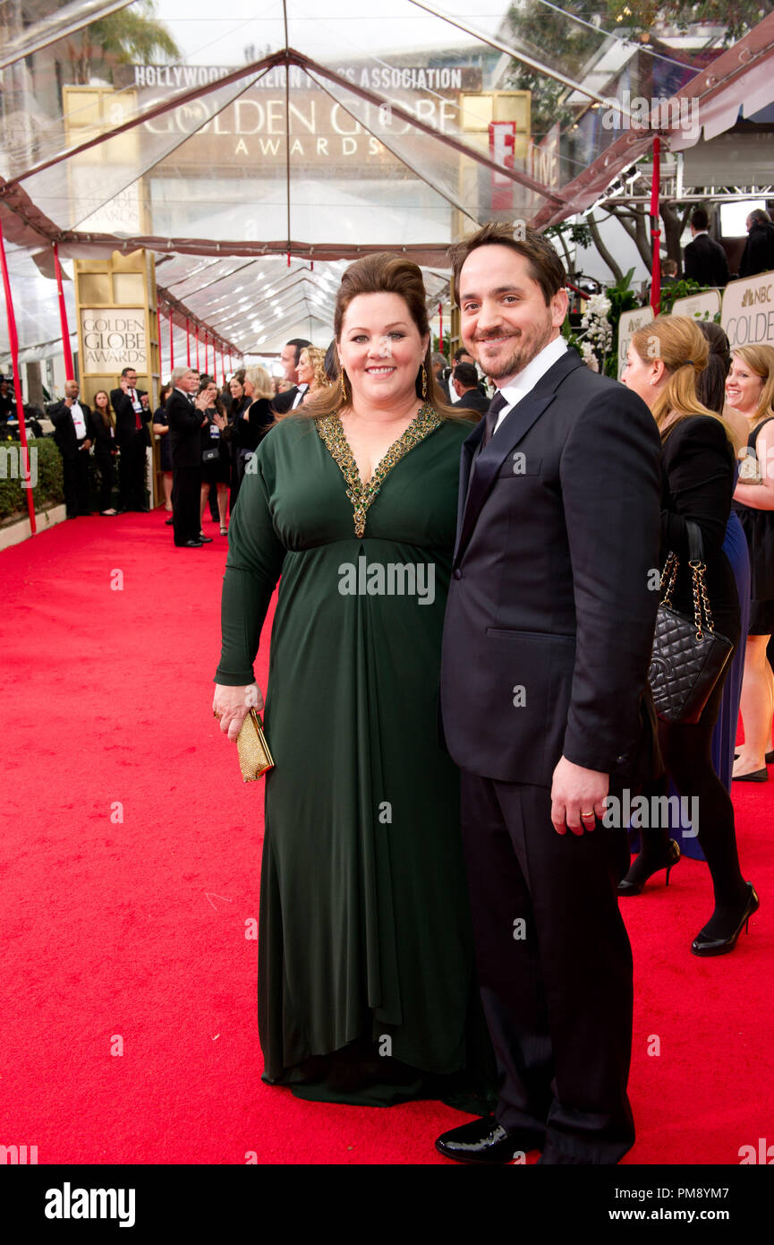 Melissa McCarthy and Ben Falcone attend the 69th Annual Golden Globes Awards at the Beverly Hilton in Beverly Hills, CA on Sunday, January 15, 2012. Stock Photo