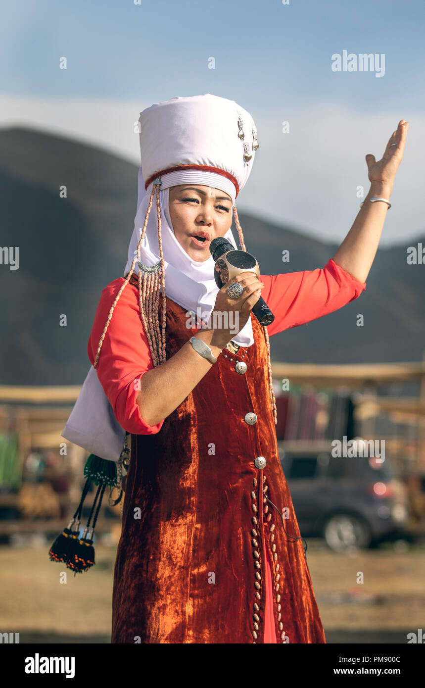 Kyrchyn, Kyrgyzstan, 6th September 2018:  Kyrgyz woman singing during World Nomad Games 2018 Stock Photo