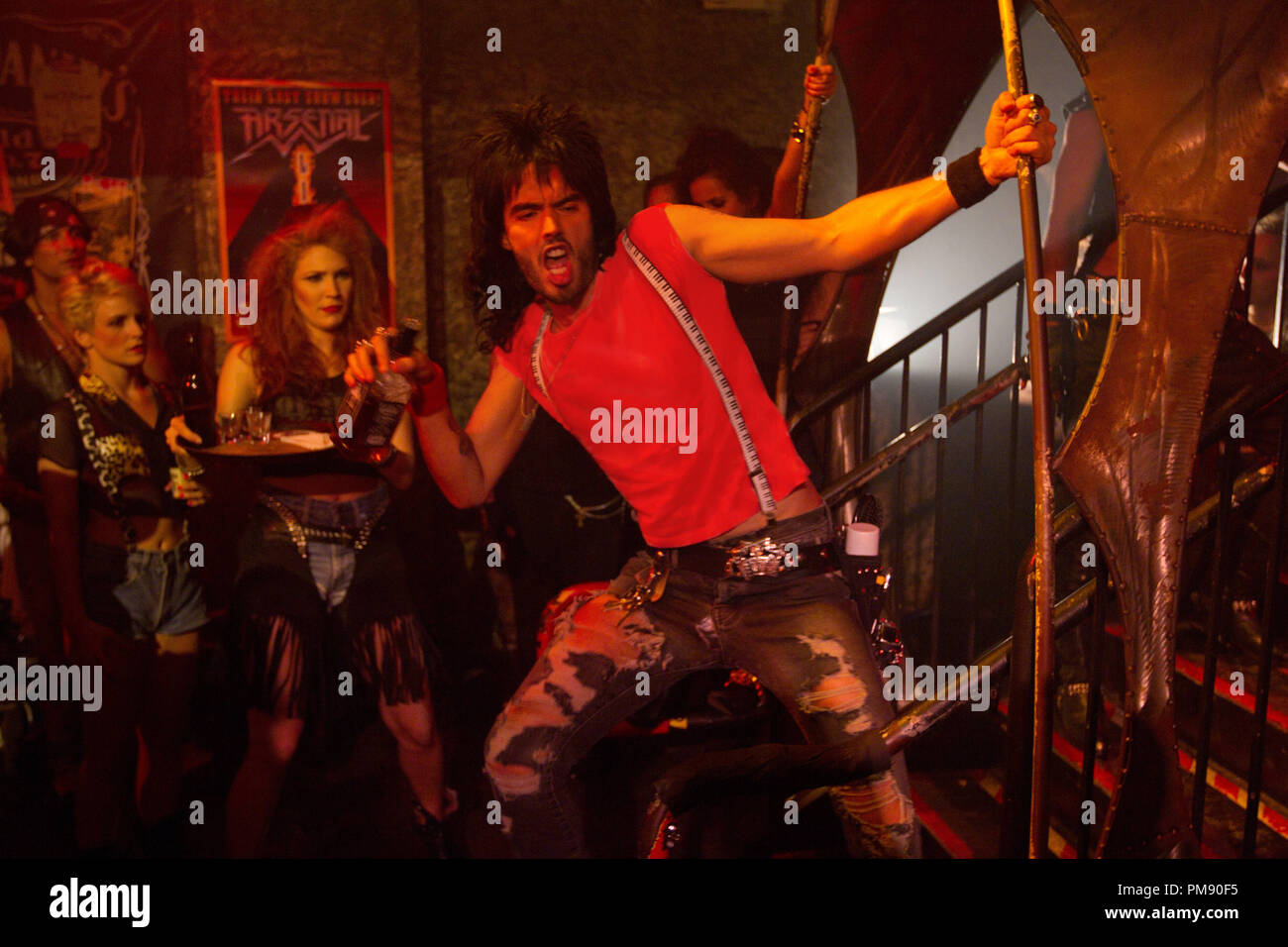 (Center) RUSSELL BRAND as Lonny in New Line Cinema's rock musical 'ROCK OF AGES,' a Warner Bros. Pictures release. Stock Photo