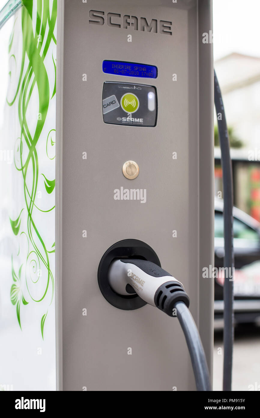 TRIESTE, ITALY - JULY 1, 2018: Detail of Scame car electric charger on the street of Trieste, Italy. Sacem is manufacturer of connectors and charging  Stock Photo