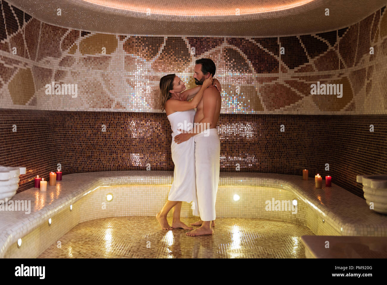 Joyful nice beautiful coupe visiting sauna together Stock Photo