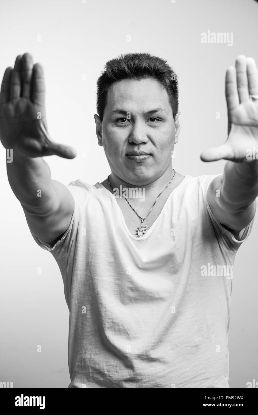Portrait of Asian Business Man Isolated With Gesture Sign Stock Photo