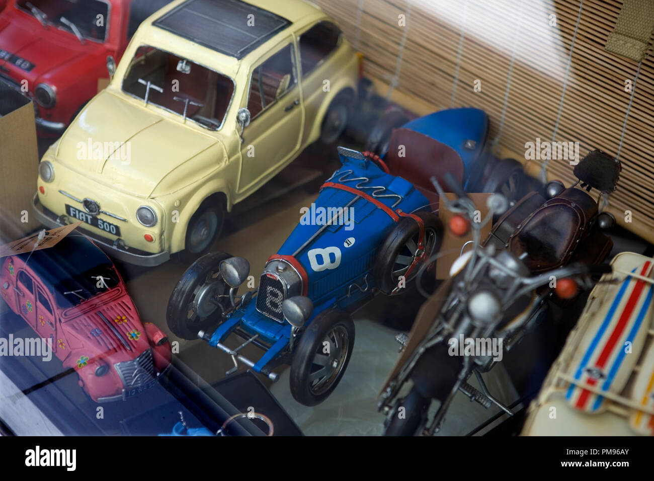Calle del Amor de Dios; Sevilla, Andalusia, Spain: classic toy cars in a shop window Stock Photo