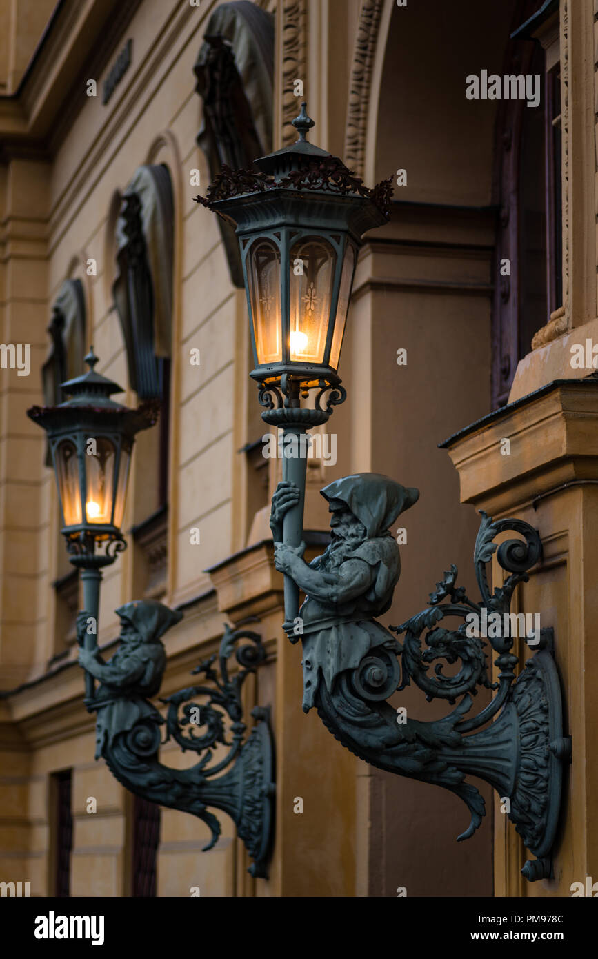 Statues holding light Stock Photo Alamy