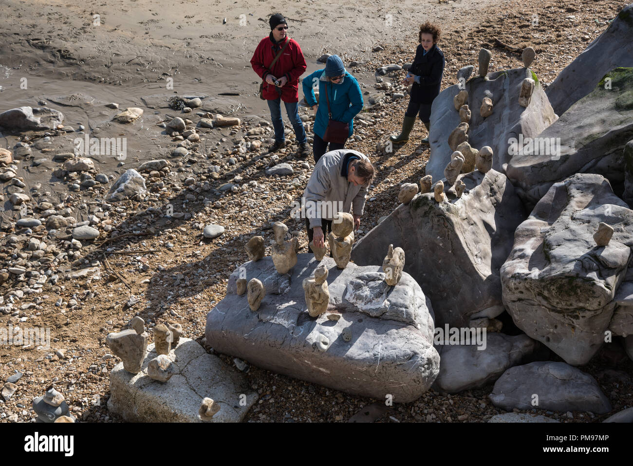 Old man balancing rocks, Charmouth beach, Dorset, UK Stock Photo
