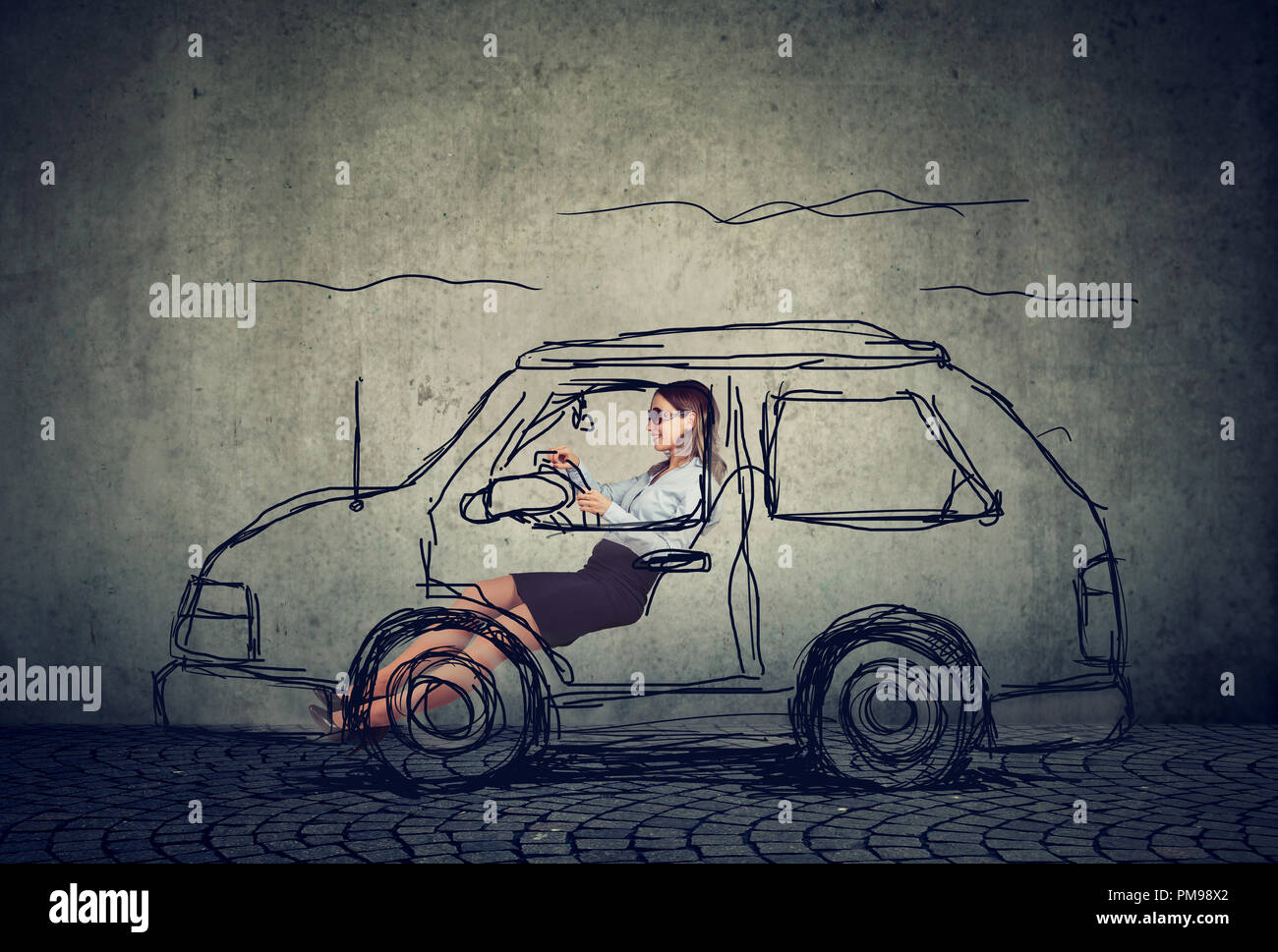 happy young woman driving a car Stock Photo