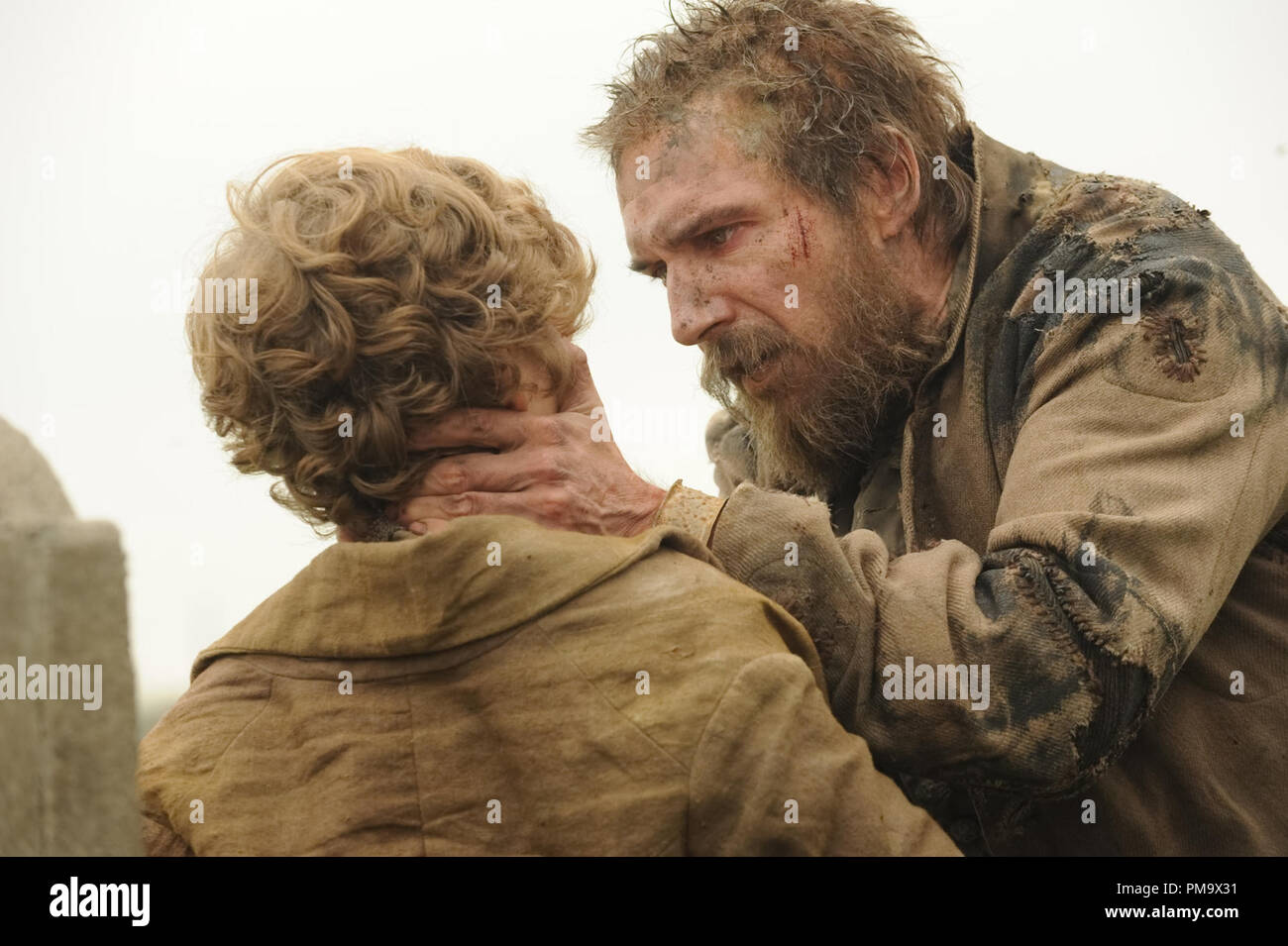 Toby Irvine stars as Young Pip and Jason Flemyng stars as Joe Gargery in Outsource Media Group's Great Expectations (2012) Stock Photo