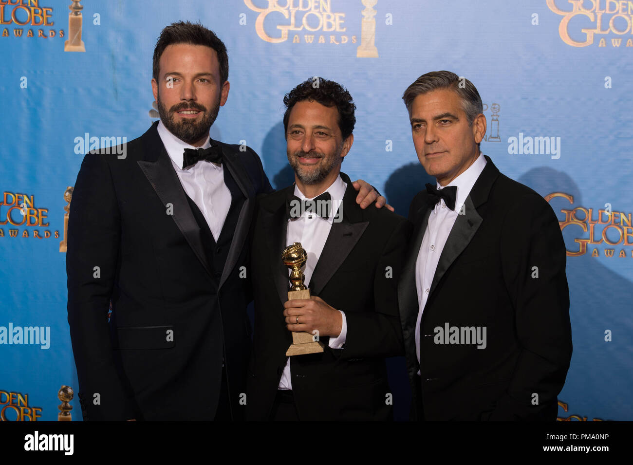 For BEST MOTION PICTURE – DRAMA, the Golden Globe is awarded to “ARGO”, produced by Warner Bros. Pictures, GK Films, Smokehouse Pictures; Warner Bros. Pictures. Ben Affleck, Grant Heslov, and George Clooney pose with the award backstage in the press room at the 70th Annual Golden Globe Awards at the Beverly Hilton in Beverly Hills, CA on Sunday, January 13, 2013. Stock Photo