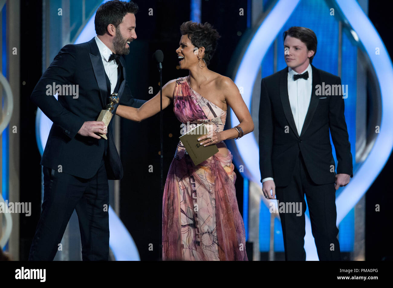 The Golden Globe is awarded to Ben Affleck for BEST DIRECTOR – MOTION PICTURE for “ARGO” from actress Halle Berry at the 70th Annual Golden Globe Awards at the Beverly Hilton in Beverly Hills, CA on Sunday, January 13, 2013. Stock Photo