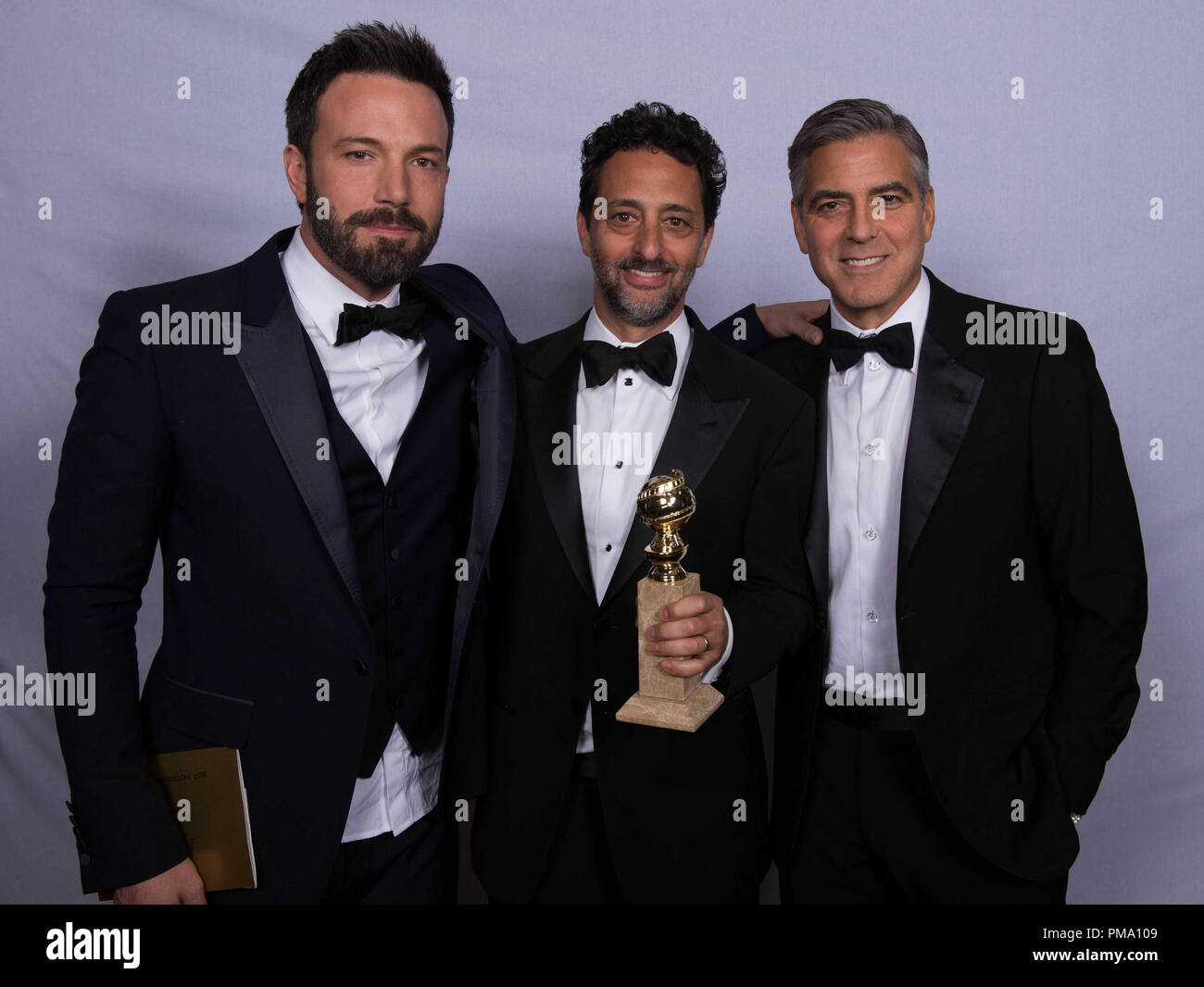 For BEST MOTION PICTURE – DRAMA, the Golden Globe is awarded to “ARGO”, produced by Warner Bros. Pictures, GK Films, Smokehouse Pictures; Warner Bros. Pictures. producers Ben Affleck, Grant Heslov and George Clooney pose with the award backstage in the press room at the 70th Annual Golden Globe Awards at the Beverly Hilton in Beverly Hills, CA on Sunday, January 13, 2013. Stock Photo