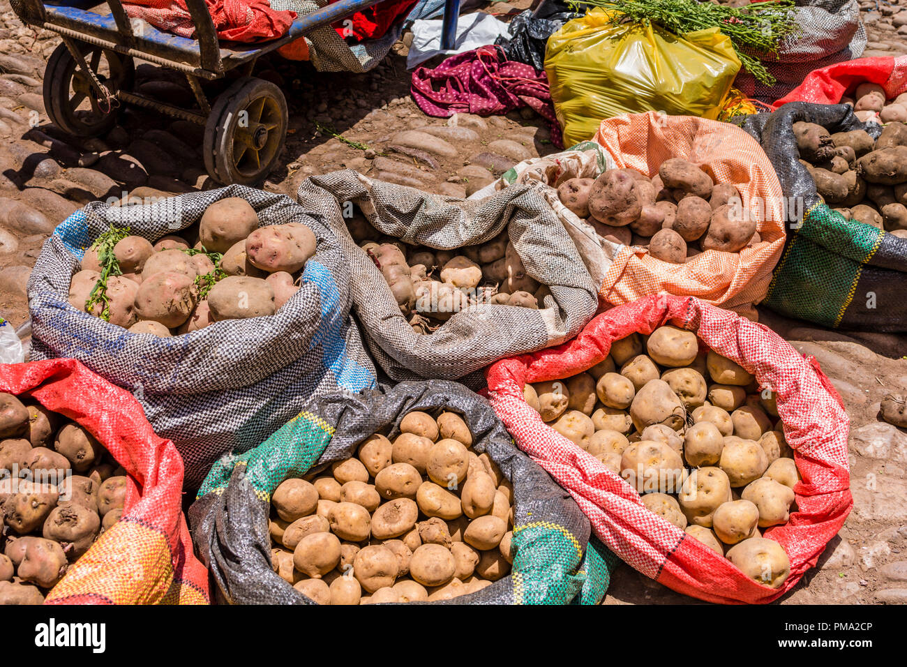 Peruvian potatoes for sale in colorful bags at Pisac Peru market. Stock Photo