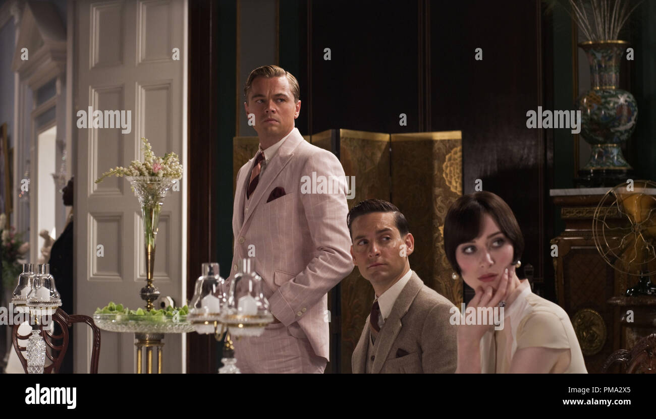 L-r) LEONARDO DiCAPRIO as Jay Gatsby, TOBEY MAGUIRE as Nick Carraway and  ELIZABETH DEBICKI as Jordan Baker in Warner Bros. Pictures' and Village  Roadshow Pictures' drama "THE GREAT GATSBY," a Warner Bros.