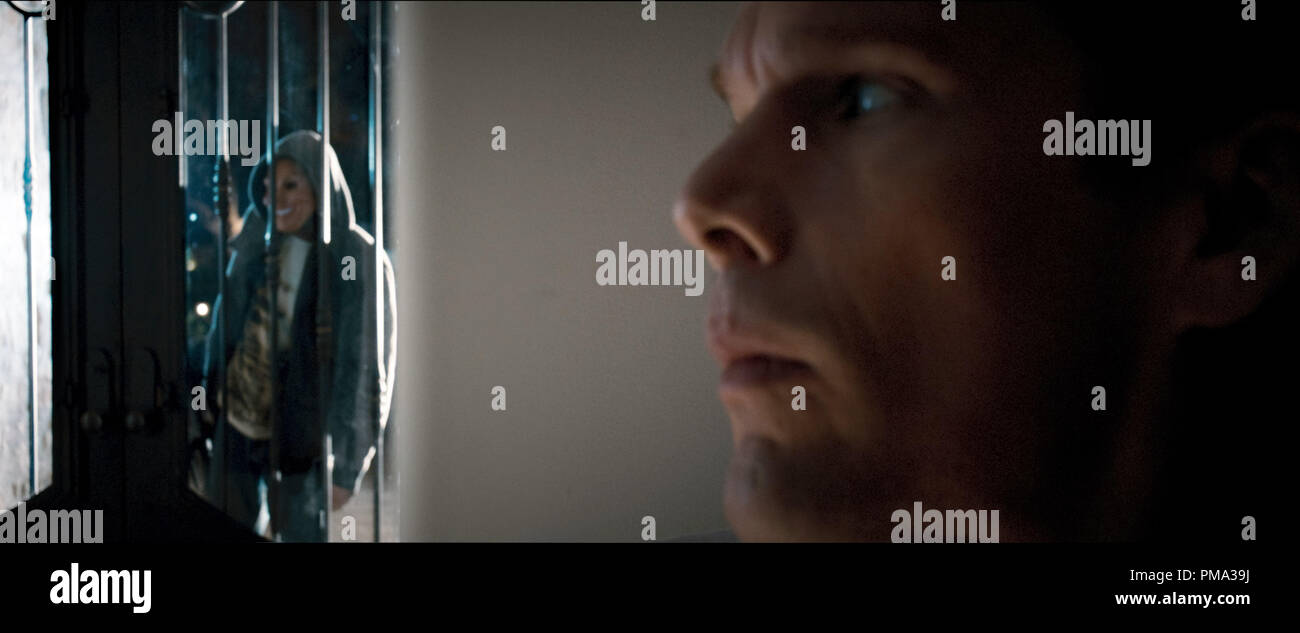 ames Sandin (ETHAN HAWKE) prepares to face an intruder in 'The Purge' Stock Photo