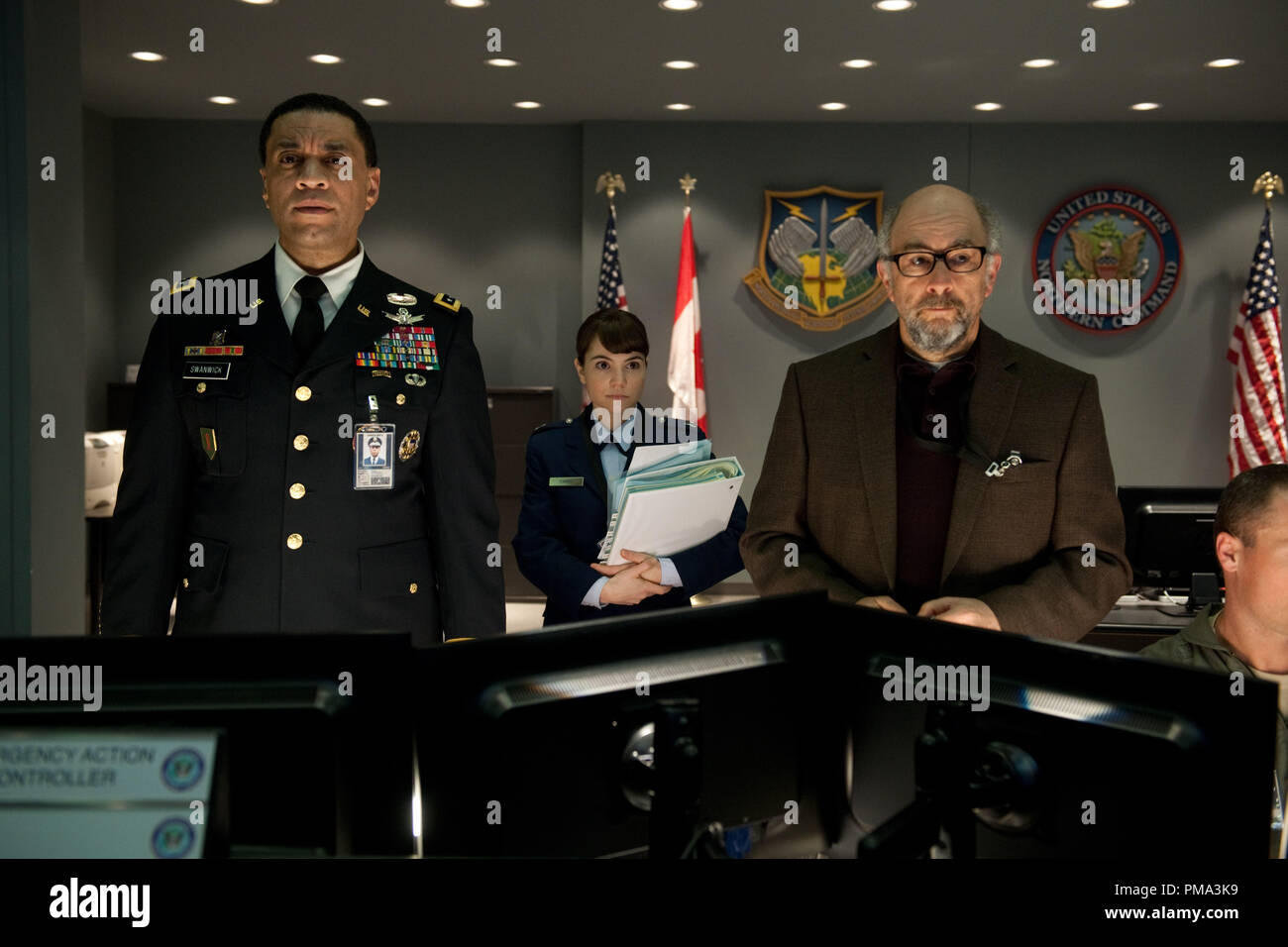 (L-r) HARRY LENNIX as General Swanick, CHRISTINA WREN as Major Carrie Farris and RICHARD SCHIFF as Dr. Emil Hamilton in Warner Bros. Pictures’ and Legendary Pictures’ action adventure “MAN OF STEEL,” a Warner Bros. Pictures release. Stock Photo