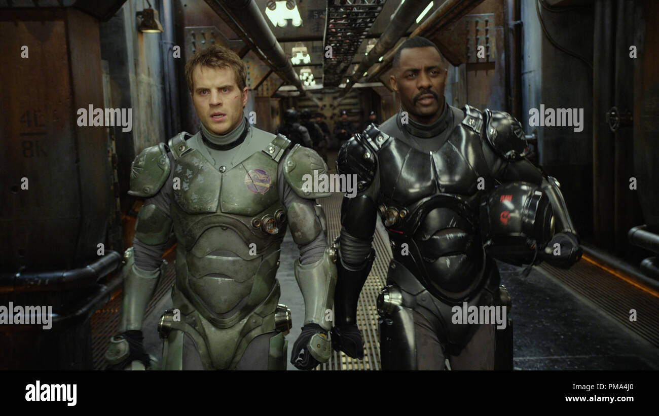 L-r) ROB KAZINSKY as Chuck Hansen and IDRIS ELBA as Stacker Pentecost in  the sci-fi action adventure "Warner Bros. Pictures and Legendary Pictures  PACIFIC RIM," a Warner Bros. Pictures release Stock Photo -