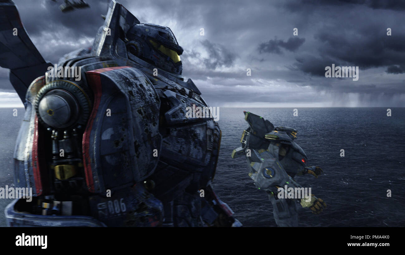 (L-r) The United States' Gipsy Danger and Australia's Striker Eureka in a scene from the sci-fi action adventure 'Warner Bros. Pictures and Legendary Pictures PACIFIC RIM,' a Warner Bros. Pictures release. Stock Photo