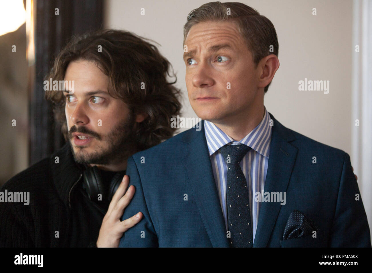 Director Edgar Wright (l) positions Martin Freeman (r) on the set of THE WORLD'S END, a Focus Features release. Stock Photo