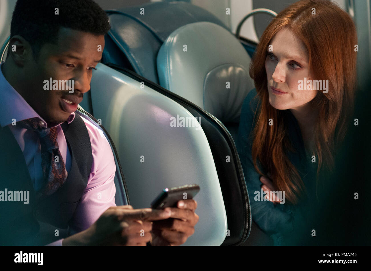 Jen Summers (JULIANNE MOORE) assists as Zack White (NATE PARKER) attempts to track the threat in 'Non-Stop'  (2014) Stock Photo