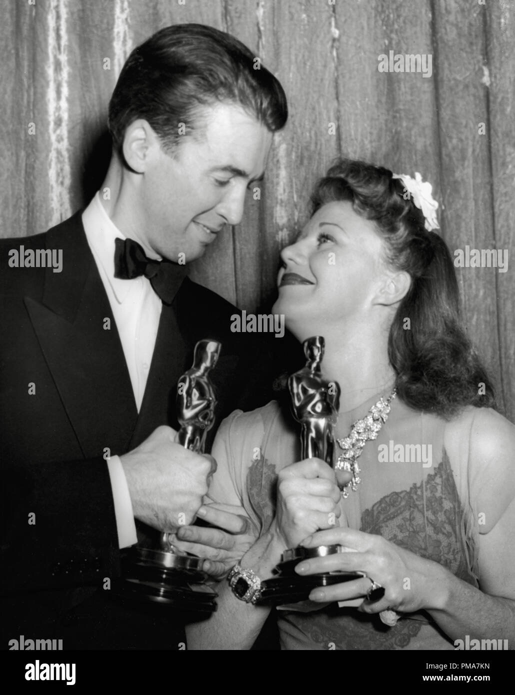 Best actor and actress James Stewart and Ginger Rogers at the 13th Annual Academy Awards banquet, 1941     File Reference # 32263 594THA Stock Photo