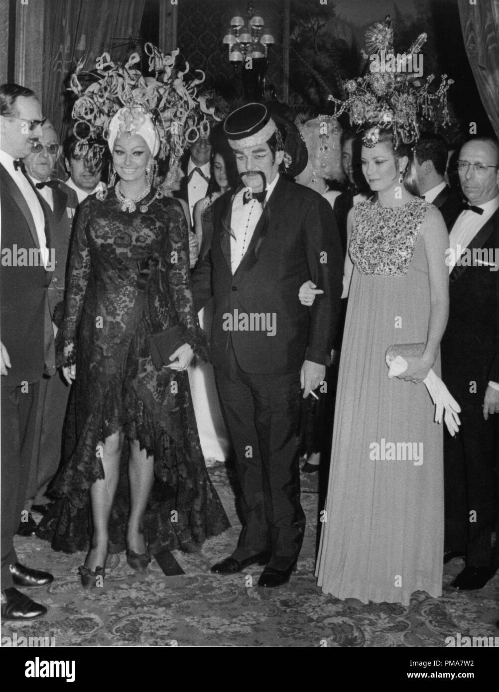 Sophia Loren, Prince Rainier and Princess Grace of Monaco at a masquerade ball in Monte Carlo, 1969  File Reference # 32263 824THA Stock Photo