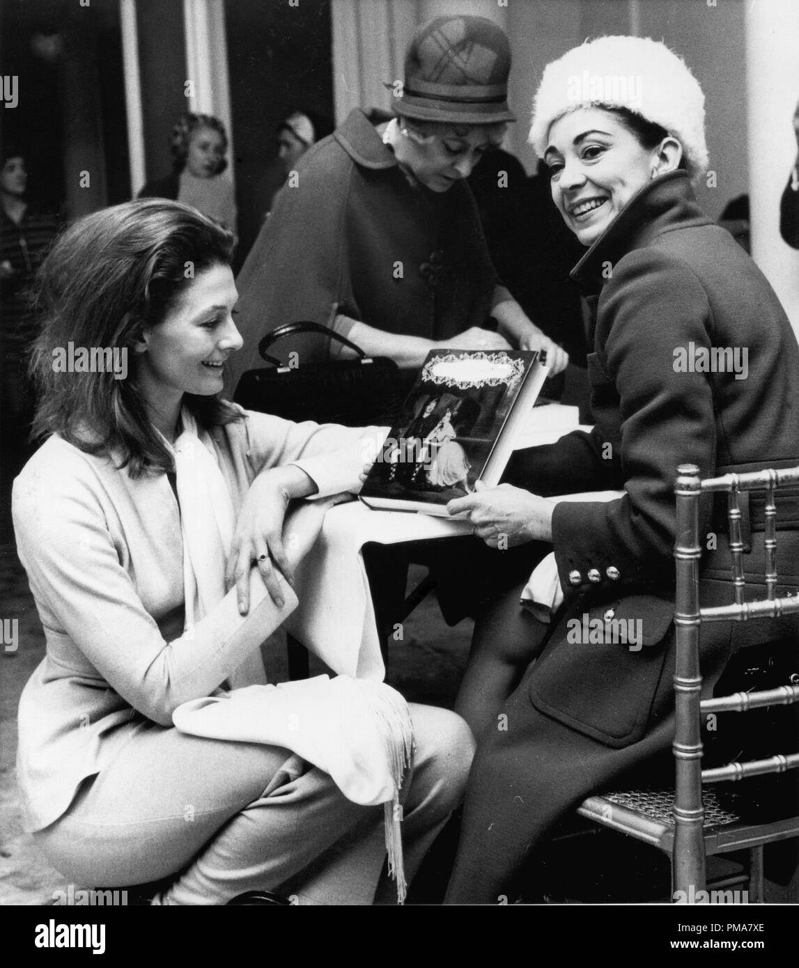 Vanessa Redgrave and Dame Margot Fonteyn signing autographs at a fashion luncheon, 1969 © JRC /The Hollywood Archive - All Rights Reserved  File Reference # 32263 860THA Stock Photo