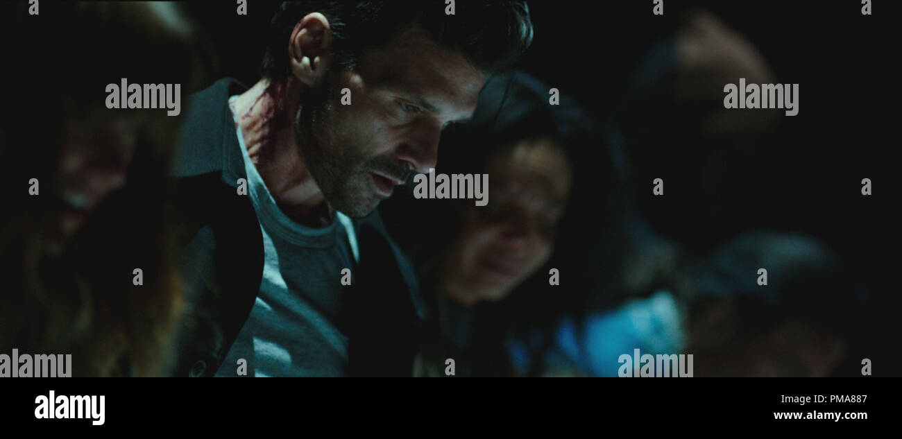 Leo (FRANK GRILLO) tries to protect his companions in 'The Purge: Anarchy' Stock Photo