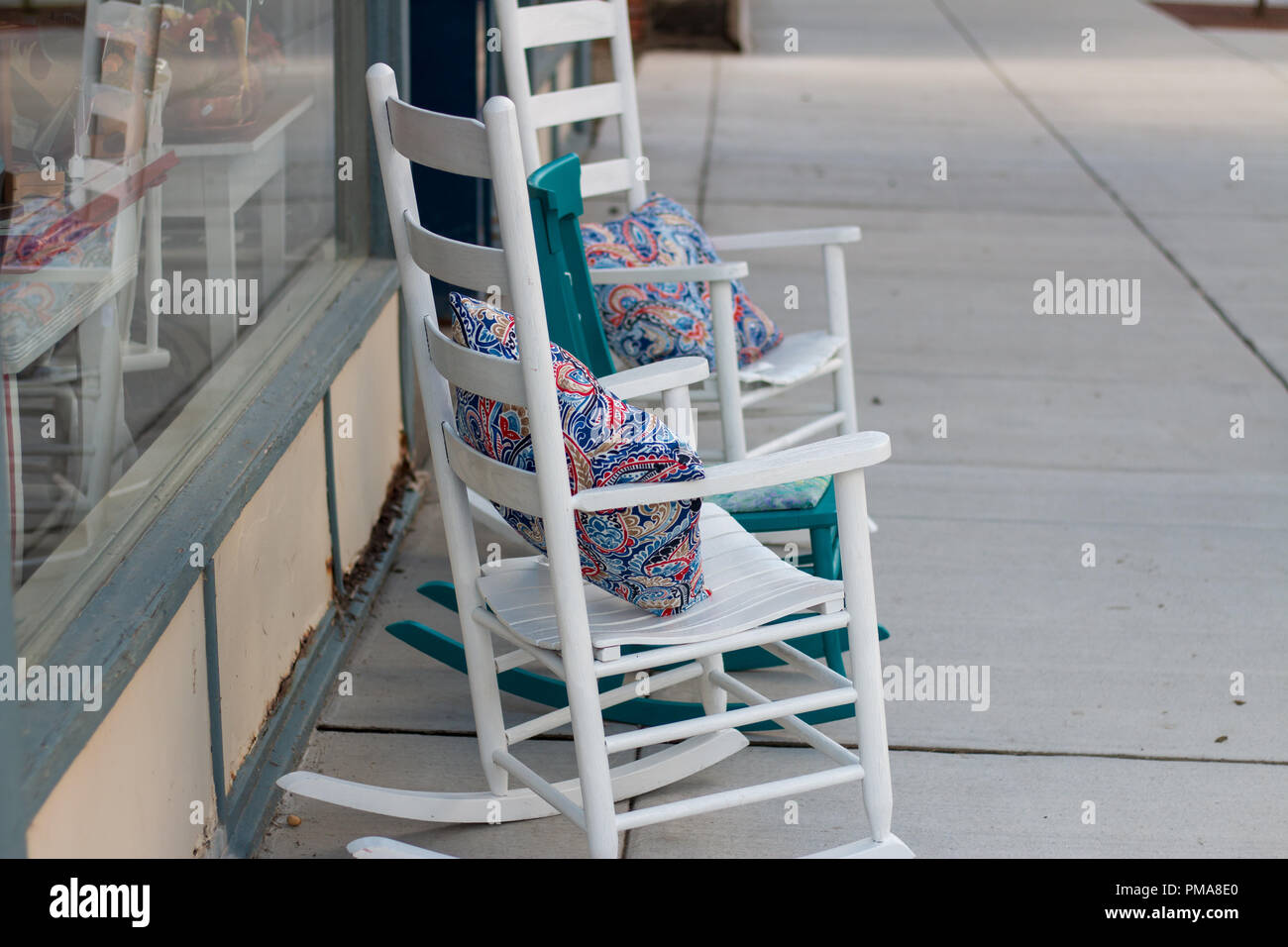 two chair on the side walk with pillows Stock Photo