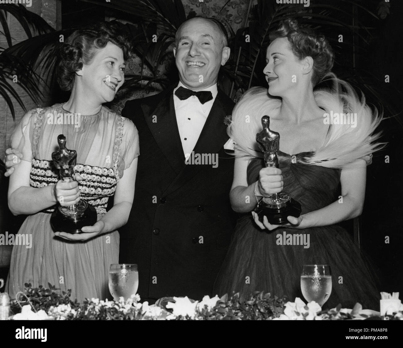 Faye Bainter, Jack L. Warner and Bette Davis at The 11th Annual Academy Awards' 1939   File Reference # 31955 639THA Stock Photo